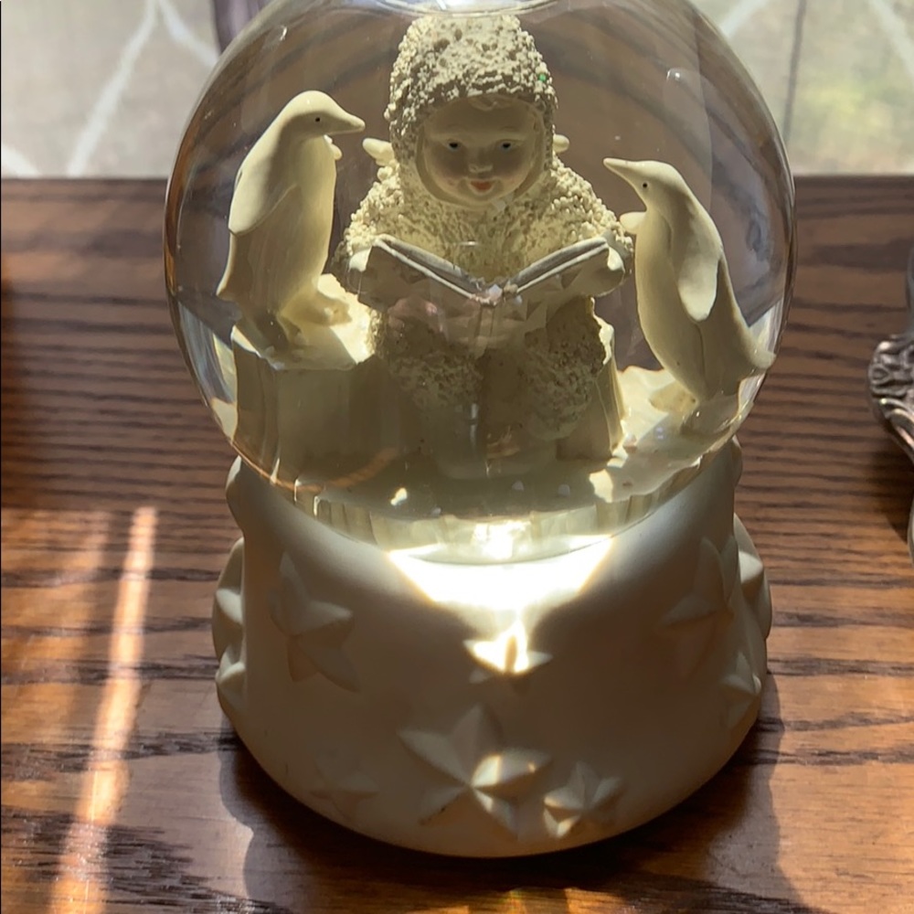 Winter snow globe- cherub and penguins